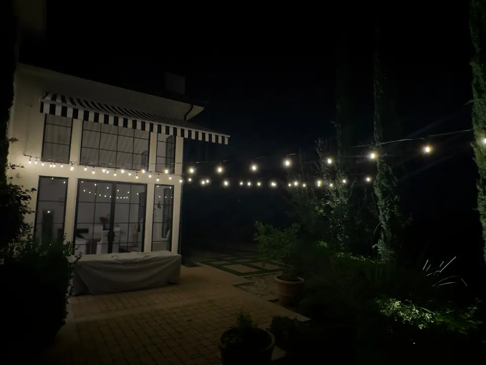 Backyard terrace with decorative string lighting