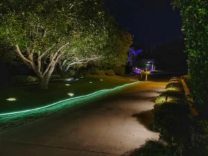 Decorative driveway lighting with green border and garden light, showcasing the best way to light up a driveway for both style and safety