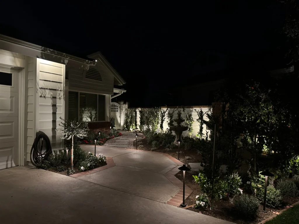 Front yard driveway and pathway landscape lighting, demonstrating the best way to light up a driveway for safe navigation and enhanced curb appeal