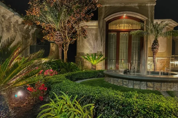Architectural and landscape lighting on luxury home garden